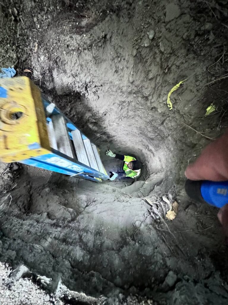 Manual excavation team working on a Burnaby property with shovels and safety equipment