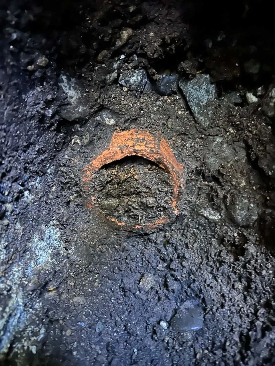 Old clay perimeter drain tile with roots and deterioration