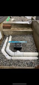 Drain tile and catch basin installation for residential drainage in Vancouver, BC.