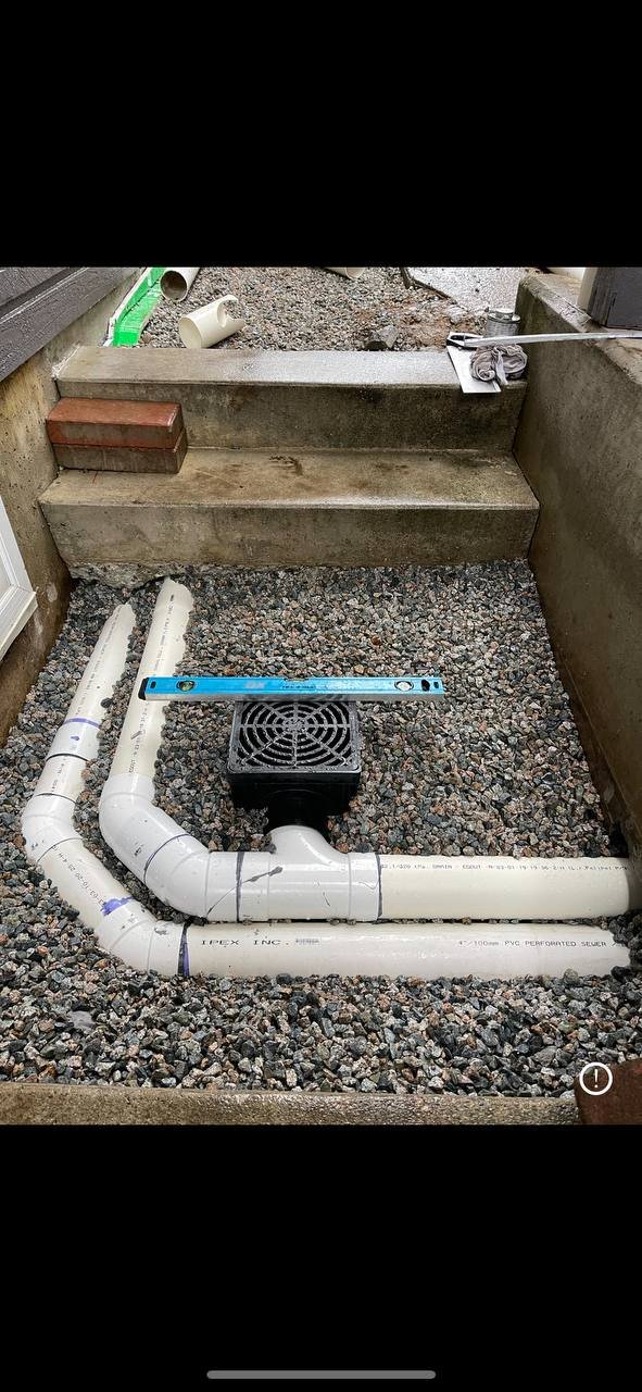Yard drainage system with drain tile and catch basin installed in Vancouver