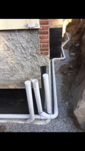 Drain tile installation along the exterior foundation of a home in Vancouver, BC.