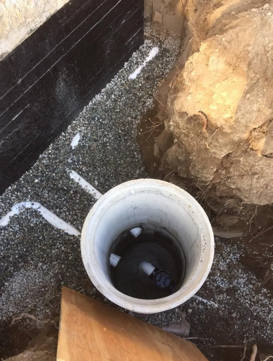 Perimeter drainage system installed around a foundation