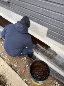 PVC drain tile installation with foundation waterproofing on a residential home in Vancouver, BC.