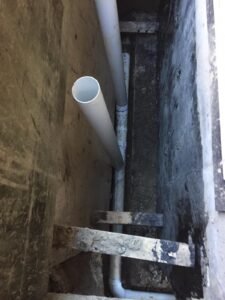 French drain installation beside a home's foundation in Vancouver
