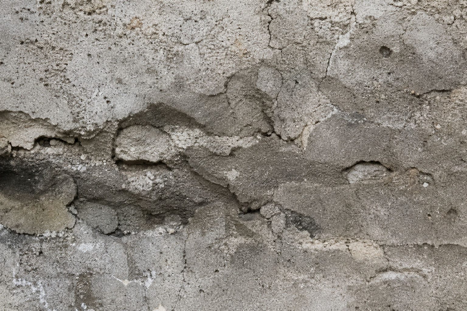 Aging concrete foundation showing deterioration and damage