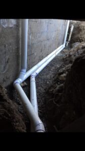 French drain pipe installed beside a home in Vancouver