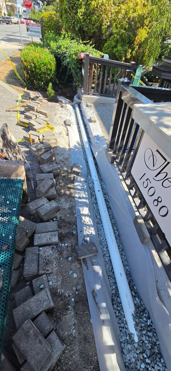 Installing new drain tile beside a foundation