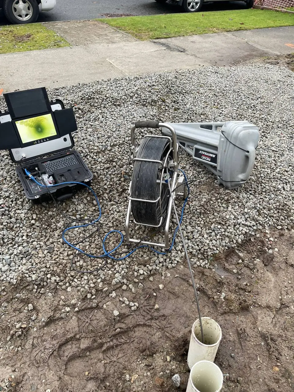 Drain camera equipment being run through underground drainage