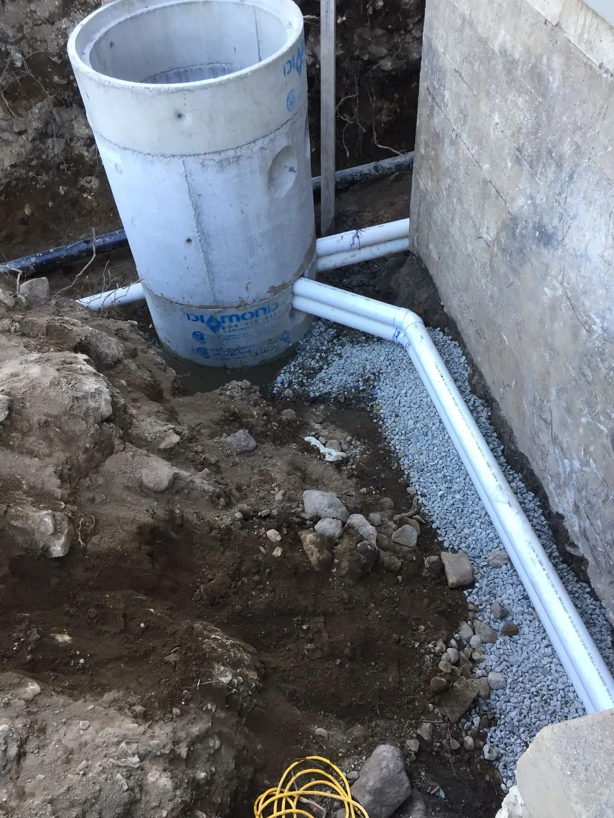 Connecting sections of a drain tile system