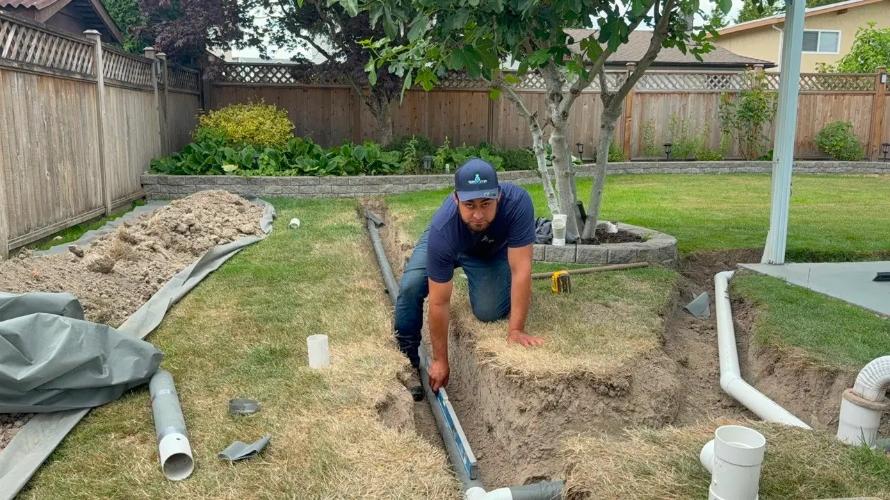 Drain tile being installed beside a foundation in Vancouver