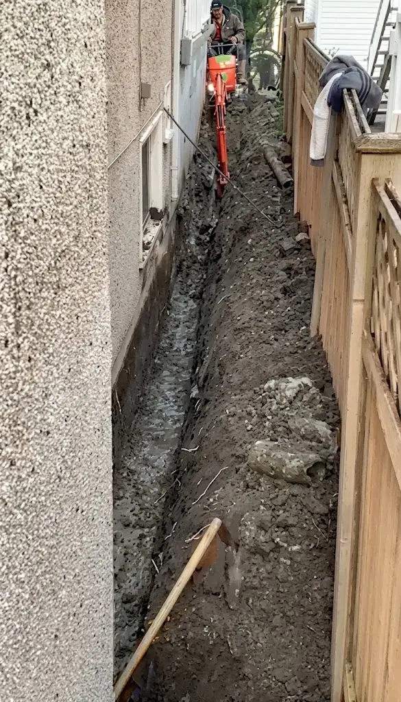 Drainage excavation beside a foundation in Greater Vancouver