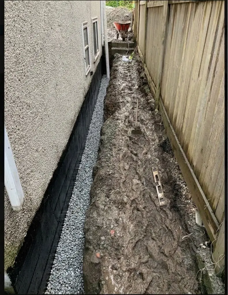 Drain rock being prepared for perimeter drain installation