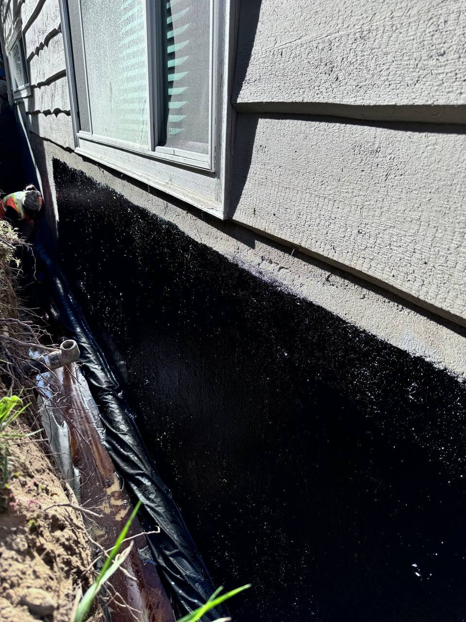 Waterproofing an exposed foundation wall