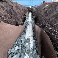 French drain installation for improved exterior drainage and foundation protection